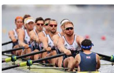 close up image of a row team rowing in their boat